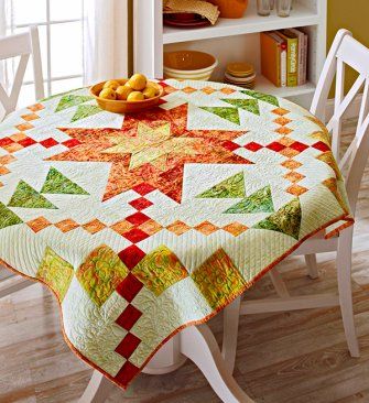 This bright quilt, perfect as a table topper or wall hanging, features a blazing star of fiery red, yellows, and orange batiks. The star shines against a pale green background. Starburst Quilt, All People Quilt, Quilting Digest, Bright Quilts, Batik Quilts, Star Burst, Quilted Table Toppers, Star Quilt Patterns, Quilts To Make