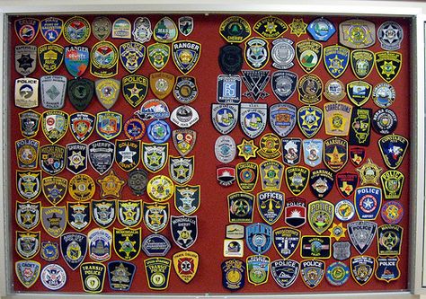 It has been said that the Illinois Criminal Justice Club uses this case to display it's large collections of patches. #Criminaljustice #Policeemblem #patchcollection Police Patches Display, Patches Display, Memory Blanket, Police Patches, Embroidered Patches