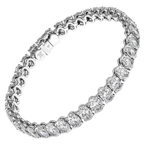 Diamond Tennis Bracelet Timeless and classic! Not your typical tennis bracelet - ovals bring nice elegant touch and look twice bigger then round diamonds - truly a statement piece Mounted in Platinum with 37 Oval diamonds - each one GIA certified - totaling 18.67ct (0.5 ct each stone): • 0.50ct IF E GIA#6213189820 • 0.50ct VVS1 E GIA#2366289526 • 0.50ct VVS2 D GIA#6217217702 • 0.50ct VVS2 E GIA#1367485419 • 0.51ct VVS2 E GIA#2215233896 • 0.50ct VS1 D GIA#5212261290 • 0.50ct VS1 D GIA#2211144664 Luxury Oval Tennis Bracelet For Wedding, Luxury Oval Tennis Bracelet, Luxury Elegant Oval Diamond Bracelet, Luxury Modern Oval Diamond Bracelet, Luxury Oval Diamond Bracelet, Wedding Jewellery Designs, Expensive Jewelry Luxury, Diamond Tennis Bracelet, Expensive Jewelry