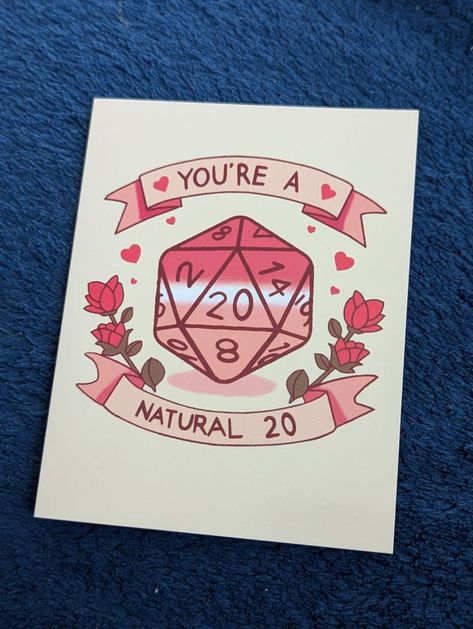 This listing is for a DND D20 dice that's rolled a natural 20 and is surrounded by roses and a banner that says Your'e a Natural 20. The inside it left blank for your own personal message. A perfect card for a DND player or any TTRPG fan and for any occasion. Product details: * One folding greeting card with an envelope on high quality card. * Card has a cream background. * Card size 14 cm x 11 cm with white envelope included. * Each card features a unique image designed by Cthulhu Loves Crafts. Please check out our other items for sale in our shop link below. https://cthulhulovescrafts.etsy.com Ph'nglui mglw'nafh Cthulhu R'lyeh wgah'nagl fhtagn! Dnd Present Ideas, D&d Birthday Card, D&d Birthday, Dnd Birthday Cards, D&d Party, Dungeons And Dragons Birthday, Valentines Birthday, Bday Gifts, D20 Dice