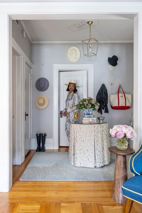 Renter entering the apartment's light grey entryway through the front door New Jersey Apartment, Grey Entryway, Apartment Entry, Apartment Table, Table Skirts, Small Kitchen Island, Shoe Storage Solutions, Home Decor Brand, Rental Apartment