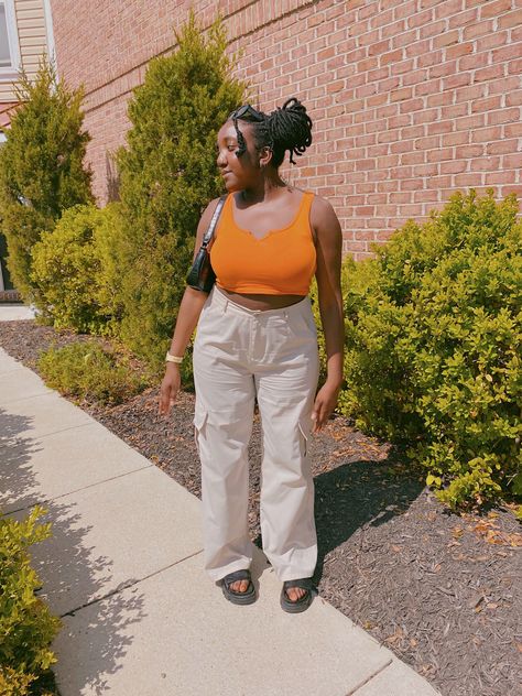 This outfit was styled with an orange crop top from Target, cargo pants from PLT and chunky soled sandals from H&M. Orange Crop Top Outfit, White Cargo Pants Outfit, Orange Top Outfit, Focused Aesthetic, Cargo Outfit, White Cargo Pants, Top Summer Outfits, Orange Crop Top, Cargo Pants Outfit