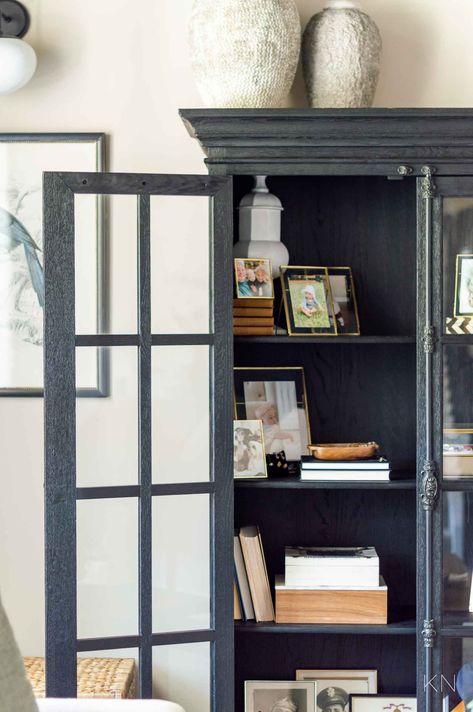 Glass Cabinet Decor, Bookshelf Styling Ideas, Conversation Room, Glass Door Cabinets, Black Display Cabinet, Carved Tray, Curio Cabinet Decor, Glass Cabinets Display, Bookshelf Styling