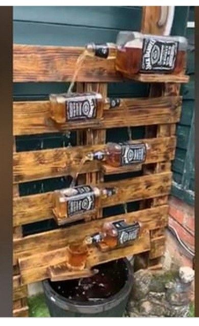 Jack Daniels Bottle Crafts Diy, Empty Liquor Bottle Ideas, Jack Daniels Bottle Crafts, Food Fountain, Jack Daniels Decor, Whiskey Bottle Crafts, Empty Liquor Bottles, Diy Ponds Backyard, Beer Bottle Crafts