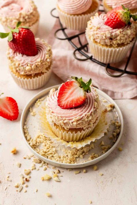 The Best Strawberry Almond Cupcakes | Emma Duckworth Bakes Herbal Cupcakes, Dainty Cakes, Valentine's Cupcakes, Big Strawberry, Almond Cupcakes, Roasted Strawberry, Lemon Meringue Tart, White Chocolate Shavings, Cupcakes Filled