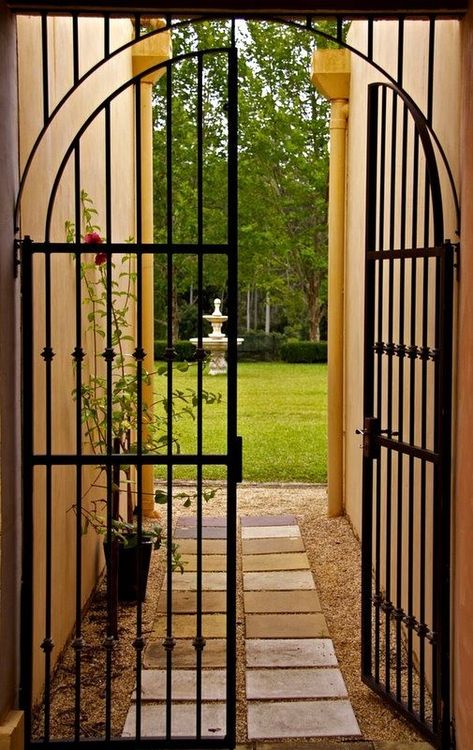 Gated Courtyard Entrance, Doors Ideas Interior, Iron Front Gate, Spanish Gate, Iron Main Gate, Entry Organizer, Iron Main Gate Design, Wrought Iron Security Doors, Iron Security Doors