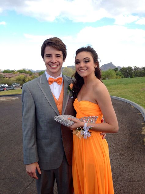 Orange And Gray Prom Couple, Orange Prom Couple, Bright Orange Prom Dress, Prom Tuxedo Ideas, Homecoming Couples, Prom Couples Outfits, Orange Prom Dress, Mens Tux, Grey Tux