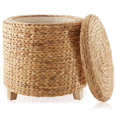 PRICES MAY VARY. Stylish and eco-friendly: Crafted from sustainable water hyacinth, this handwoven storage ottoman adds a touch of nature's beauty to your living space. Water hyacinth is known for its rapid growth and renewability, making it an eco-conscious choice for furniture. Acacia wood feet: Designed with Acacia wooden feet, which ensure stability and durability for years to come. The wood's natural grain patterns and warm tones beautifully contrast with the water hyacinth weave, adding to Storage Cube Ottoman, Round Storage Ottoman, Foot Rest Ottoman, Round Storage, Ottoman Footstool, Round Ottoman, Water Hyacinth, Stylish Storage Solutions, Furniture Protection