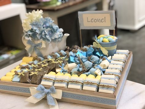 New born baby boy decorated chocolate tray in blue and yellow with a touch of brown Baby Chocolate Decoration Boys, Baby Giveaways Ideas, Baby Boy Chocolate Decoration, Chocolate Table, Chocolate Tray, Baby Giveaways, Baby Boy Decorations, Chocolate Babies