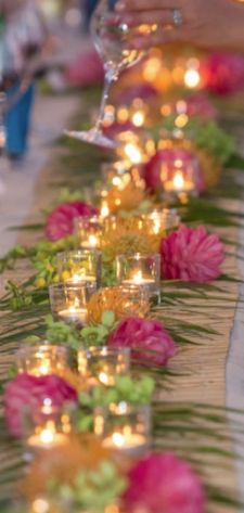 Palm leaves create a "runner" - fun for long teen tables, with candles or glow Leaf Table Runner, Luau Table Setting, Palm Leaves Table Runner, Luau Centerpieces, Havana Nights Party Theme, Havana Nights Theme, Holiday Party Crafts, Havana Nights Party, Party Table Centerpieces