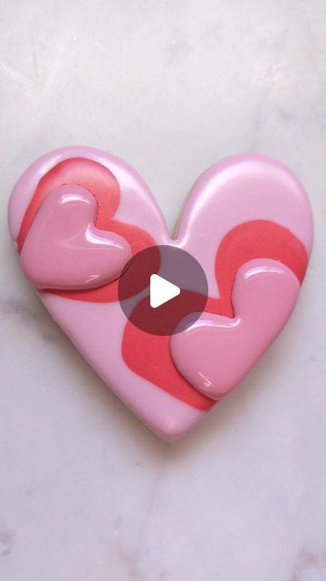 Sonja on Instagram: "Anyone getting sick of hearts yet?? But seriously hearts are one of my favorite shapes to decorate ❤️ . .the one part of the heart got a little wonky, but I kinda like it! Abstract! . #cookiedecorating #cookiedecorator #cookievideo #cookiereel #love #lovecookie #heartcookie #heart #sugarcookiedecorating #sugarcookiemarketing #sugarcookiesofinstagram #sugarcookievideo #sugarcookiereel #royalicingvideo #royalicingreel #royalicingcookies #royalicing #decoratedsugarcookies #decoratedcookies #decoratedvalentinecookies #decoratingreel #valentinesday #valentines #valentine #valentinecookies" Heart Shaped Cookies Decorated, Cutout Cookies Decorated, Heart Shaped Sugar Cookies, Cookies Valentines, Royal Cookies, Heart Sugar Cookie, Cutout Cookies, Parts Of The Heart, Amazing Food Decoration