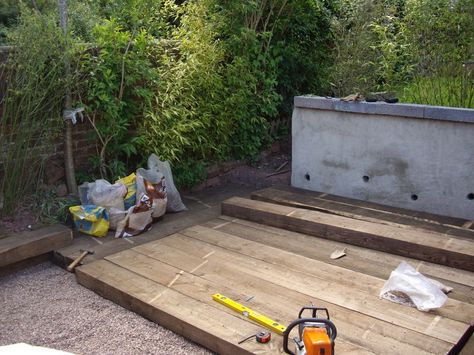 Decking with new railway sleepers Sleeper Patio Ideas, Railway Sleepers Decking, Sleeper Deck, Sleeper Decking, Sleeper Path, Railway Sleeper Garden Bed, Using Sleepers In The Garden, Wooden Railway Sleepers, Garden Border Railway Sleepers