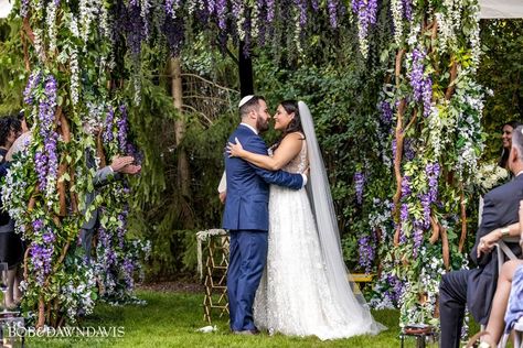 Rosyln’s man of honor, Doug, opened his home to this incredible surprise wedding! What a shock for the guests when they walked to the backyard and saw a chuppah covered in wisteria. They thought they were there for an engagement party but instead, the bride and groom said I DO! A beautiful and meticulously planned wedding by Lindsay Cohen of Designer Event Chicago. Photography: @bobanddawndavis #bobanddawnphotography Event Planner: @OfficialDEC Event Designer: @hmrdesigns #surprisewedding Wisteria Chuppah, Floating Chuppah, Man Of Honor, Wedding Chuppah, Man Of Honour, Wedding Spain, Surprise Wedding, Chicago Photography, 2024 Wedding