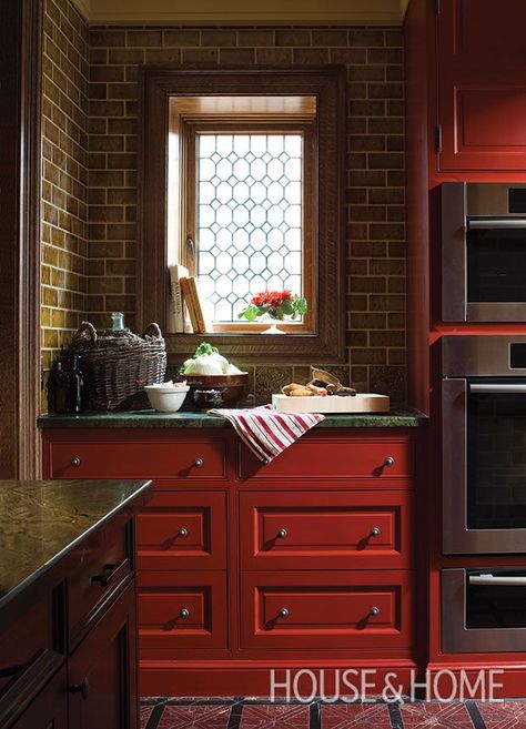 “The colors are complementary, so they work well together,” says designer Theresa Casey of this kitchen’s deep red cabinetry and dark green countertop. | Photographer: Ted Yarwood Size Of Kitchen Island, Diy Finish Basement, Moody Kitchen, Small Laundry Room Ideas, Marble Floors, Painted Cabinets, Kitchen Drawer Organization, Dark Kitchen, Laundry Room Ideas