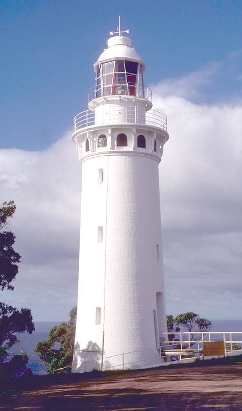 Laminated card with rounded corners. Size: 2.25” x 4.5” White lighthouse with weather vane. N50 Lighthouse With House, Inside Of A Lighthouse, Fastnet Lighthouse, Beach Sculpture, Eilean Mor Lighthouse, White Lighthouse, Fisgard Lighthouse, Sculpture Inspiration, House Wallpaper