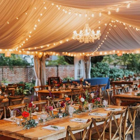 Cherry Blossom Weddings|Events on Instagram: "S + P had the perfect fall tented wedding! Natural wood tables complimented with bright fall florals, greenery and bistro lighting created the perfect ambiance for their special day! Photo: @smackthatbird . . . . #fallwedding #fallweddings #fallweddinginspiration #tentedwedding #fallcolors #vawedding #vaweddingplanner #tablescapes #dcweddingplanner #dmvweddingplanner" Tent Wedding Reception Decorations, Tent Aesthetic, Wedding Tent Lighting, White Tent Wedding, Wedding Tent Decorations, Autumn Reception, Flower Fairy Lights, Tent Wedding Reception, Meadow Wedding