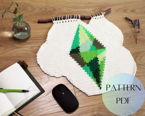 Sims Crochet Pattern, Wall Hanging Decor Diy, Crochet Tapestry Wall Hanging, Gamer Crochet, Geeky Crochet Patterns, Crochet Wall Hanging, Crochet Wall Hangings, Dekor Diy, Sims Games