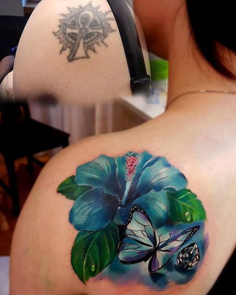 The old tattoo is rather simple to cover up, but get that opportunity to cover it up and make a much more beautiful design. Here, an old tattoo turns into a realistic and beautiful Hibiscus flower and butterfly. Rose Tatooes, Shoulder Cover Up Tattoos, Cover Up Tattoos Before And After, Flower And Butterfly Tattoo, Flower Cover Up Tattoos, Tatuaje Cover Up, Butterfly Tattoo Cover Up, Cover Up Tattoos For Women, Butterfly Tattoo On Shoulder