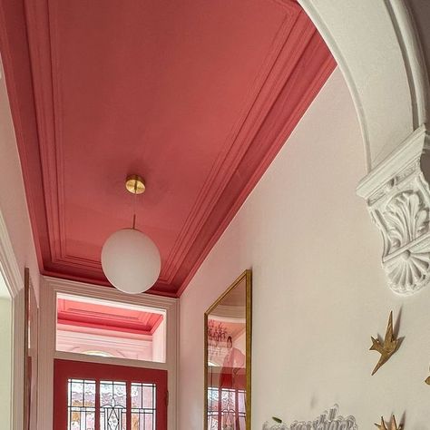 Lou Crane on Instagram: "I don’t mean to alarm anyone but as I walked down the stairs I was greeted with sunshine through the glass. I’m off to investigate before it turns out to be a false alarm 😂  #hallway  #paintedceiling  #pinkdecor  #periodfeatures  #mintontiles" Green Pink Hallway, Pink Ceiling Hallway, Coloured Ceiling Hallway, Hallway Ideas Bright, Red Interior Door, Hallway Ideas Apartment, Funky Hallway Ideas, Hallway Painted Ceiling, Coral Hallway