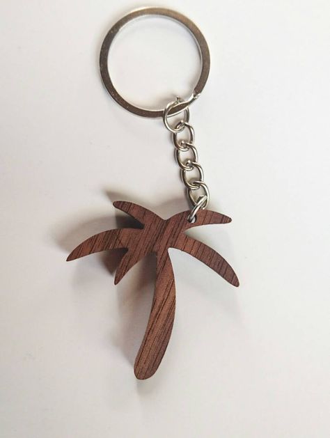 Wooden Palm Tree Keychain, Walnut Wood, Caribbean Keychain, Environmental Friendly Green materials This lovely handmade keychain is made out of best quality walnut wood. It is hand sanded and oiled with ECO friendly danish oil, so it will look great on your house, car or any other keys! It is 44mm wide, 48mm high and approximately 5mm thick. With less than 10g, it is extremely lightweight. Keychain will be shipped in 3 working days in a small gift box (see picture), so you can also use it for gi Keychains Ideas, Palm Tree Jewelry, Tree Keychain, Awesome Woodworking Ideas, Wooden Ideas, Woodworking Organization, Wood Usb, Wood Jewelery, Laser Cut Wood Crafts