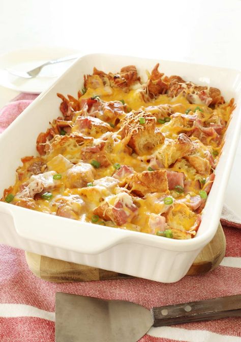 This ham and cheese croissant breakfast casserole is the best way to use your leftover ham. A savory breakfast bake with cubed croissants, ham, cheese and eggs. Croissant Ham And Cheese Casserole, Cubed Croissants, Ham And Cheese Croissant Casserole, Ham Egg Bake, Holiday Breakfast Casserole, Croissant Casserole, Ham And Egg Casserole, Croissant Breakfast Casserole, Ham And Cheese Casserole