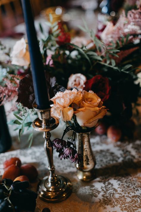 Moody floral pieces + candles with vintage-inspired gold decor | Image by Emily Delamater Photography Moody Castle Wedding, Scottish Inspired Wedding, Fall Castle Wedding, Vintage Inspired Wedding Decor, Dark Fairy Tale Wedding, Castle Wedding Decorations, Castle Wedding Aesthetic, Moody Vintage Wedding, Antique Wedding Decorations