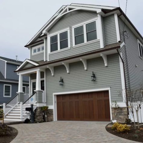 75 Beautiful Coastal Green Exterior Home Pictures & Ideas - May, 2021 | Houzz Seafoam Green House Exterior, Coastal Sage Vinyl Siding, Coastal Exterior House Colors, Coastal Exterior Homes, Coastal Cottage Exterior, Beach House Exterior Colors, Coastal House Exterior, Green Exterior Paints, Coastal Green