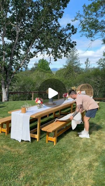 Mason Smith on Instagram: "When I started planning my wife Baby Shower, I knew that she had always wanted a long table where all her friends could sit and eat together. So I looked up a few ideas and here’s what we ended up with. We have rented tables before and always have friends and family needing large tables like this, so I thought it was time we built our own that we can use and let our loved ones use whenever they need them. I just used 10 foot 2x6 and 2x4 Doug Fir wood boards and deck screws. Then for the table runner I found some clearance fabric from the Joann’s Fabric and had them cut it to the size I needed! My wife absolutely loved it and that’s what matters most, but I’d love to know what you would have changed? 💐 #husband #table #diy #dad #babyshower #longtable #tablebuild" Big Outdoor Table Diy, Long Outdoor Table Diy, Picnic Table Landscaping, Backyard Bungalow, Wood Patio Table, Pool Gazebo, Patio Table Decor, Diy Exterior, Porch Table