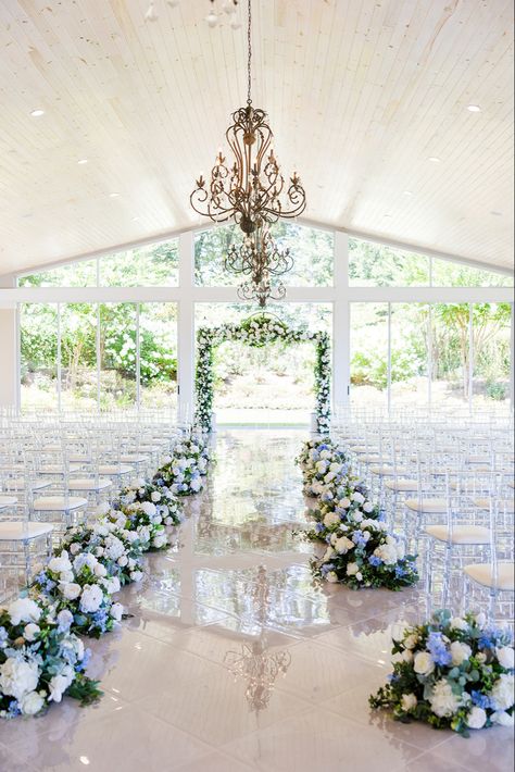 Blue White and purple florals lining the aisle at the (Tate House Wedding) Venue in Jasper Georgia white marble floors natural light wedding inspiration decor Blue Themed Wedding Decoration, Wedding Venues Blue And White, Wedding Venue Blue Theme, Blue Ceremony Decor, Dusty Blue And Navy Wedding Theme Wedding Ceremony Decor, Wedding Venues Light Blue, Dusty Blue And Sage Green Table Decor, Floral Wedding Stage Decor, Pops Of Blue Wedding