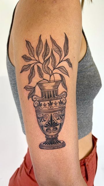 Greek Woman Tattoo Design, Lower Knee Tattoos Women, Plant Vase Drawing, Vase With Leaves Tattoo, Fine Line Flower Vase Tattoo, Vase Design Tattoo, Ceramic Vase Tattoo, Vase Tattoo Ideas, Greek Plant Tattoo