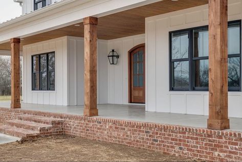 Wood Beams Front Porch Farmhouse, White House Brick Porch, White House Wood Porch, White Farmhouse With Wood Columns, Natural Wood Columns Front Porches, Front Porch With Cedar Posts, Farmhouse Posts Front Porches, Farmhouse Front Walkway, White House With Wood Accents