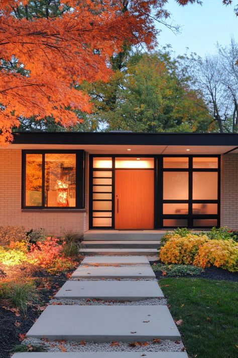 Mid-century modern house with vibrant autumn leaves. Peek at the retro charm of 60s style house exteriors and find inspiration for adding a splash of timeless groove to your home. Midcentury Home Exterior, Mid Century House Exterior, Midcentury Modern House Exterior, Modern Mid Century House, 60s Architecture, Butterfly Roof, Suburban House, Midcentury Home, 60s Style