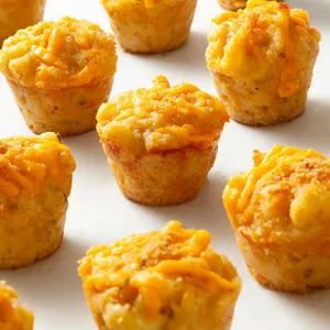 Mac and Cheese Bites Recipe: How to Make It Mac Cheese Bites, Vegetarian Finger Food, Muffin Cups Recipes, Cheese Bites Recipe, Cups Recipes, Tasty Appetizers, Mac And Cheese Bites, Homemade Cheese Sauce, Hot Appetizers