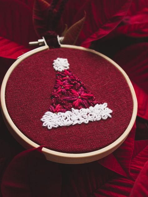 Happy Holidays, I'm so excited to share this PDF Pattern for a this Santa hat embroidery design! This design is the perfect combination of a classic Santa Hat with a signature christmas flower: Poinsettias! Using a beautiful combination of vibrant reds and whites and 4 basic stitches, this pattern is super beginner friendly and makes for the coziest christmas craft. Embroidery Santa, Christmas Embroidery Patterns, Basic Stitches, Pattern Template, Christmas Embroidery Designs, Embroidery Christmas, Hat Embroidery, Christmas Embroidery, Handmade Holiday