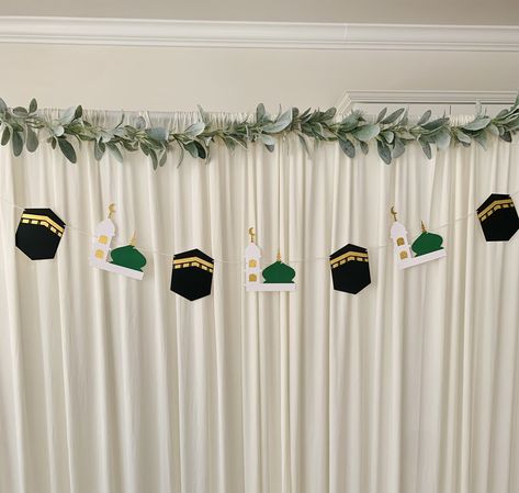 This banner is made with high quality cardstocks.  This banner measures up to  4ft 8in approximately with 4kaaba pennants and 3madina pennants.  This will be a good ad on for Eid decorations, Hajj Mubarak decorations etc. Please also check other products from this shop https://houseofzaam.etsy.com Umrah Mubarak Decorations Ideas, Ramzan Mubarak Decoration, Banner Maulidur Rasul, Rabi Ul Awal Decoration Ideas, Milad Decoration Ideas At Home, Maulid Decoration, Hajj Decorations Ideas, Hajj Mubarak Decoration Ideas, Umrah Decoration Ideas