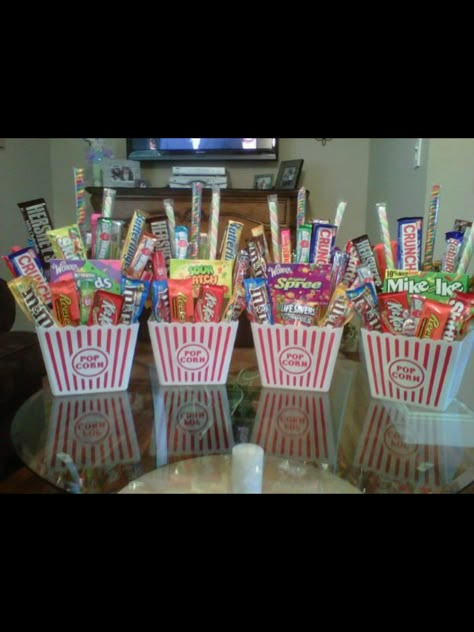 I have these popcorn containers, would be perfect with 50's theme candy in them. Candy Centerpiece Ideas Birthday, Popcorn Basket Diy, Popcorn Centerpiece Ideas, Popcorn Bucket Gift Ideas, Candy Centerpiece Ideas, Movie Popcorn Gift Basket, Popcorn Bowl Gift Basket, Candy Themed Raffle Basket, Family Movie Night Gift