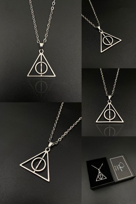 Step into the magical world of Harry Potter with our handcrafted Deathly Hallows Triangle Necklace. This bewitching accessory is not just a piece of jewelry, but a symbol of power and immortality, making it a must-have for any true fan of the series. Crafted with meticulous attention to detail, it represents the Deathly Hallows symbol, a representation of the Elder Wand, the Resurrection Stone, and the Cloak of Invisibility - the three most powerful objects in the wizarding world. Cloak Of Invisibility, Resurrection Stone, The Elder Wand, Deathly Hallows Necklace, Harry Potter Necklace, Fanfic Ideas, Deathly Hallows Symbol, Elder Wand, The Deathly Hallows