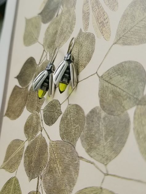 "Visit us at https://tandbrie.com for more about T and Brie, all of our jewels and our artistic process. That is also where you can sign up for our occasional email updates and notifications. Follow us out there - @tandbriedesign https://www.facebook.com/TeresadelaGuardia/Firefly Earrings with Gem, Peridot Earrings, Insect Earring set with Peridot, Glowing Firefly Jewelry, Firefly Earring with Gemstones, August Birthstones The Firefly, the enigmatic summertime favorite, captured in antiqued Ster Firefly Earrings, Firefly Jewelry, Wedding Lehenga Designs, Peridot Earrings, August Birthstone, Green Peridot, August Birth Stone, Stunning Jewellery, Firefly