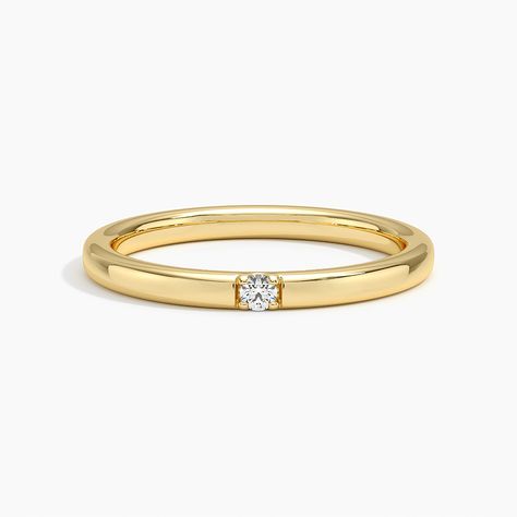 2mm Rae Diamond Ring - 18K Yellow Gold. A single diamond sparkles within a band of precious metal in this sleek and elegant 2mm ring. Gold Band With Small Diamond, Flush Wedding Ring Set, Wedding Bands For Women Gold, Minimalist Gold Rings, Birthstone Wedding Band, Small Diamond Ring, 2mm Wedding Band, Dimond Ring, Small Diamond Rings