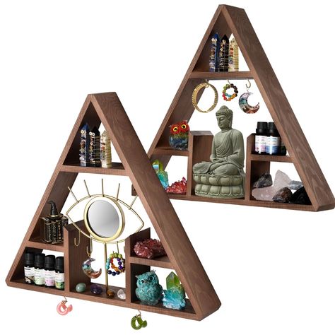 PRICES MAY VARY. An Eye-Catching Design - Seated in the middle of our crystals display is a removable evil eye inspired mirror with golden lashes and hooks where you can hang your witchy accessories or astrology trinkets. Generous Space - Measuring 17x15x2.5”, this triangle essential oil shelf with removeable evil eye mirror is large enough for storing and displaying your collection of crystals, precious rocks, gems, and essential oils. Classic, Rustic Look - Our display shelf for collectibles h Altar Shelf, Crystal Display Shelf, Eye Mirror, Knick Knack Shelf, Mirror Crystal, Crystal Shelf, Witchy Room, Essential Oil Shelf, Meditation Decor