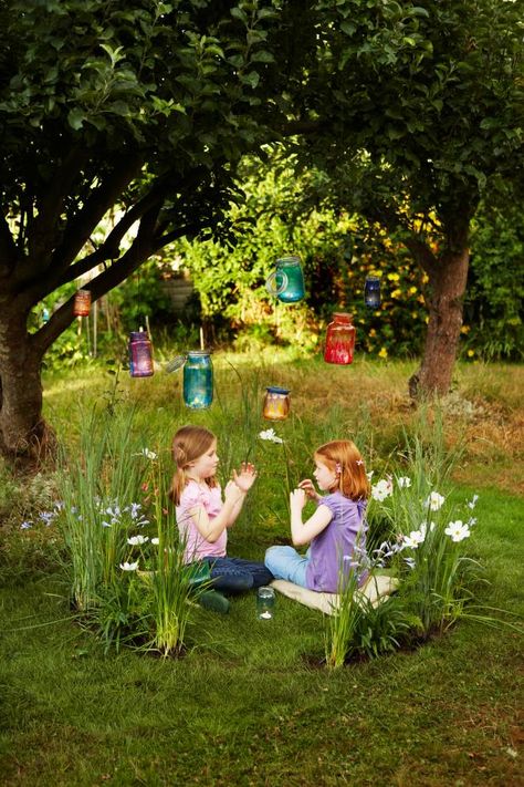 15 magical fairy gardens for kids including one kids can actually get INSIDE. I love the wagon turned fairy garden, too! Outdoor Kids Play Area, Hgtv Garden, Play Garden, Trees And Flowers, Fairy Lanterns, Fairy Ring, Faeries Gardens, Meteor Garden 2018, Children's Garden