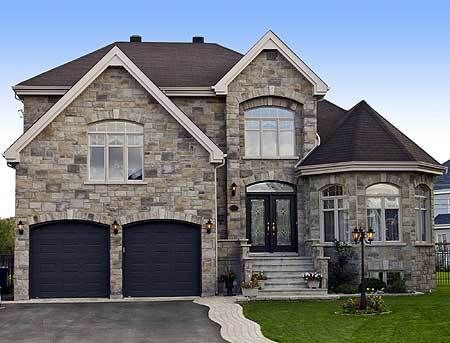 Designed for a narrow lot, this European home plan has a very imposing stone exterior complete with a turret. An air-lock entry foyer keeps the cold air out of the main living space and ushers you into the home. Three large windows and a cathedral ceiling enhance the living room that is open to the dining room. A step-down family room with a corner fireplace will be your family's favorite gathering spot. Double doors on the second floor usher you into the large master suite with its own private Modern Traditional Home Exterior, Small House Remodel, Townhouse Exterior, House Paint Color Combination, Pool House Plans, Stone Exterior, Dream Life House, European Home, Modern Style House Plans