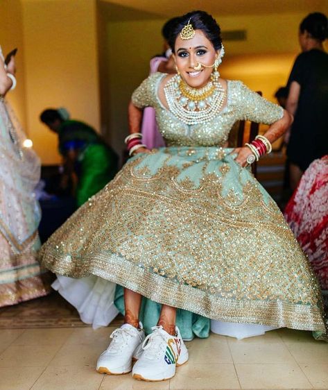 #shaadiwish #indianwedding #indianbride #bride #weddingshoes #shoes Bridal Lehenga Images, Lehenga Images, Comfortable Bridal Shoes, Bridal Footwear, Bridal Sneakers, Bridal Lehenga Designs, Wedding Sneakers, Bridal Lehenga Red, Indian Wedding Ceremony