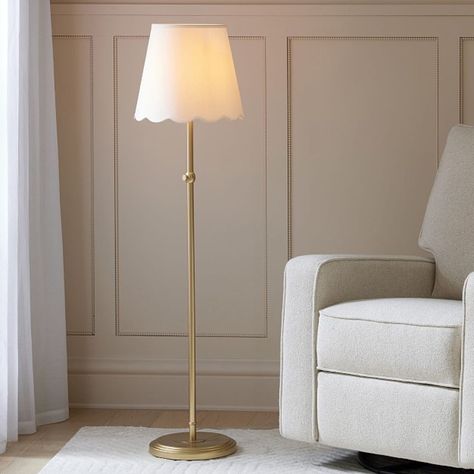 Give their space a charming glow with our Amelia floor lamp. The adjustable height puts light where they need it, while the scalloped shade adds a touch of delicate detail. DETAILS THAT MATTER Cast from iron. Features a hand-applied, oil-based finish in Light Gold. Shade features a linen exterior with a polystyrene interior in White. On/off switch located on in-line; clear cord. Height of lamp is adjustable. Features a weight base. White fabric shade is included. All our shades are designed with an UNO fitter for securing shade to base. KEY PRODUCT POINTS Pottery Barn Kids exclusive. ETL-listed. We created an interactive lighting guide to help you choose the best light for your space. Learn more. Imported. Gold Living Room Lamp, Groovy Floor Lamp, Scalloped Floor Lamp, Floor Lamp Kids Room, Kids Room Floor Lamp, Living Room With Floor Lamp, Floor Lamp Nursery, Nursery Floor Lamp, Shabby Chic Floor Lamp