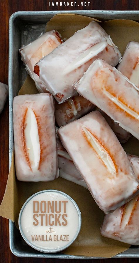 Overhead image of a metal tray fitted with parchment paper and filled with a small dish of glaze, and eight rectangular shaped donuts that are coated with a glaze. Donut Sticks Recipe, Donut Sticks, Homemade Donuts Recipe, Glazed Donut, Homemade Donuts, Doughnut Recipe, Fried Dough, Donut Recipes, Beignets