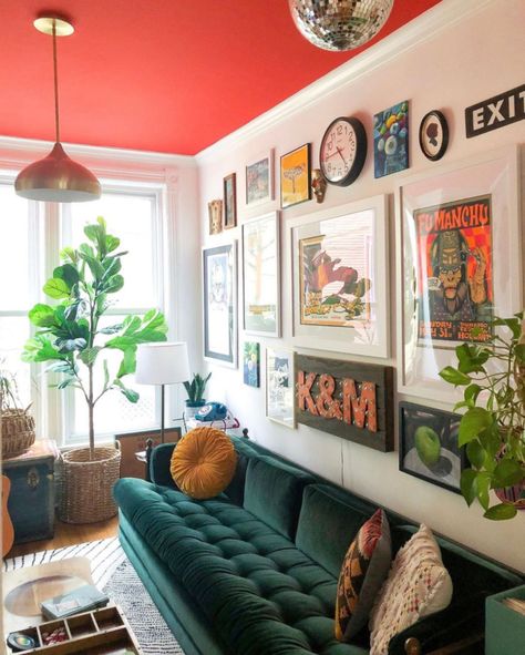 Love this colorful room with red ceiling, blue velvet sofa and eclectic gallery wall #gallerywall #velvetsofa #paintedceiling #colorfuldecor #colorlovers #eclecticdecor #vintagedecor #fiddleleaffig #bohodecor #redpaint #discoball #art #housetour Maximalist Living Room, Red Ceiling, South Street, Eclectic Gallery Wall, Gallery Wall Living Room, Living Room Red, Garage Apartment, Deco Retro, Eclectic Living Room