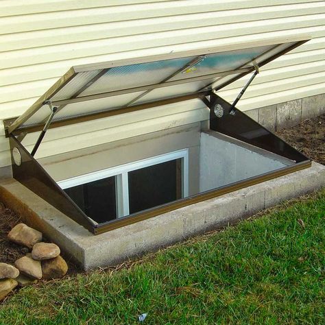 Lustercraft Egress Window Well Cover Diy Egress Window Cover, Egress Window Curtain Ideas, Basement Window Ideas, Window Well Ideas, Egress Window Landscaping, Egress Window Cover, Egress Window Well Covers, Basement Window Well Covers, Basement Egress