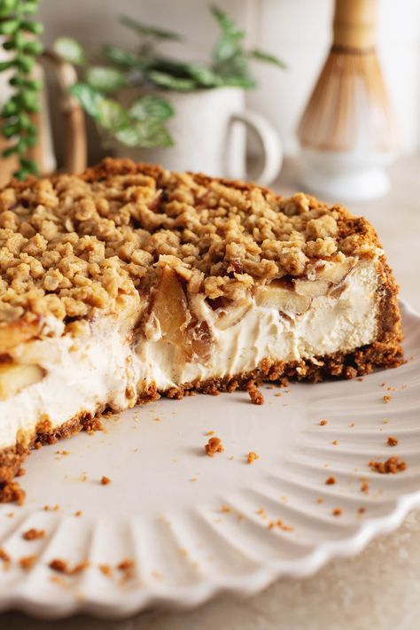 This apple crumble cheesecake is made with a biscoff cookie crust, creamy spiced cheesecake topped with tender cinnamon apples, and a crumble topping. It's the perfect rich and delicious Fall cheesecake! #applecrumble #cheesecake #fallbaking | teakandthyme.com Apple Crumble Cheesecake With Biscoff Crust, Apple Crumble Cheesecake No Bake, Easy Apple Cheesecake, Apple Crumb Cheesecake, Spiced Cheesecake, Biscoff Crust, Fall Cheesecake, Apple Crumble Cheesecake, Crumble Cheesecake