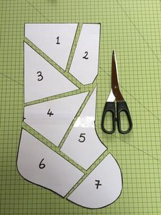 Cut up the paper template into the 7 shapes Projek Menjahit, Quilted Christmas Stockings, Christmas Sewing Projects, Christmas Stocking Pattern, Stocking Pattern, Beginner Sewing Projects Easy, Xmas Stockings, Christmas Quilts, Christmas Sewing