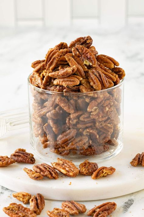 Crunchy and sweet, these maple pecans are made with sweet maple syrup, brown sugar, butter, and warm spices. Perfect for salads, snacking, cheese boards, or even prettily packaged as housewarming gifts. They’re dangerously delicious yet not overly sticky, with lower sugar than many recipes. Make them in just 20 minutes. They’re an easy and irresistible treat you’ll love to share and enjoy. Maple Pecans Roasted, Maple Candied Pecans, Spiced Pecans Recipe, Pecans Candied, Roasted Pecans Recipe, Maple Pecans, Cardamom Recipe, Brown Sugar Butter, Glazed Pecans